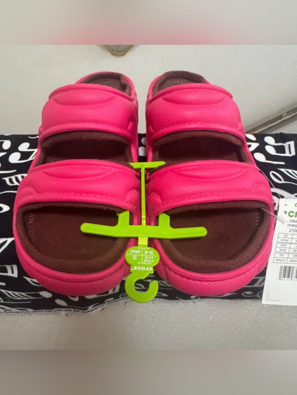 Pink over puff cozy Crocs sandals size
9woman